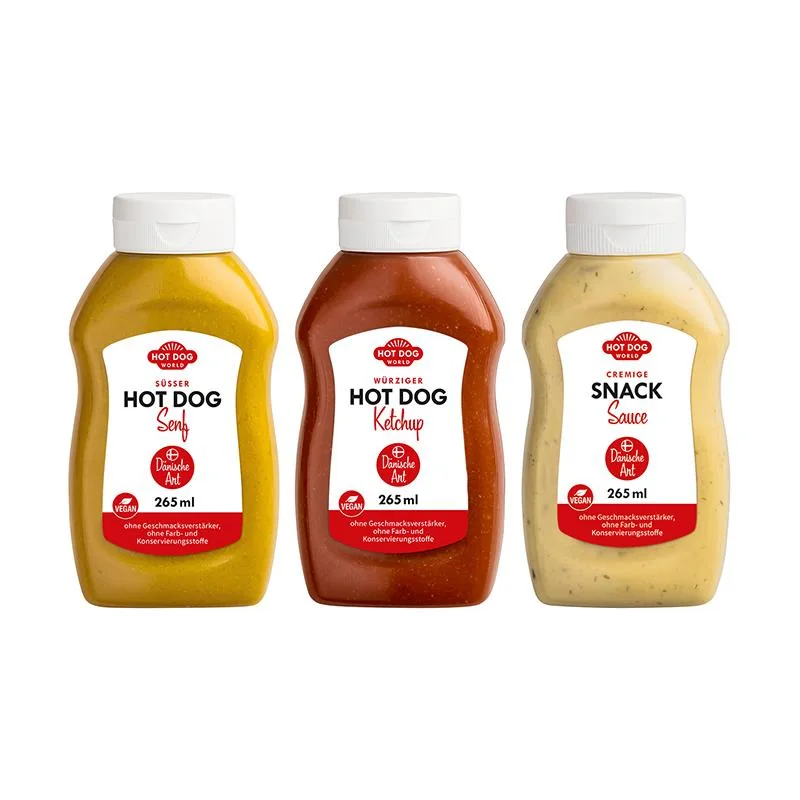 Trois flacons de sauces Hot Dog World de couleurs jaune, rouge et crème.
